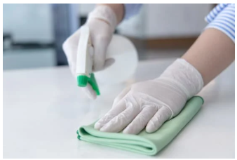 Hand cleaning a countertop